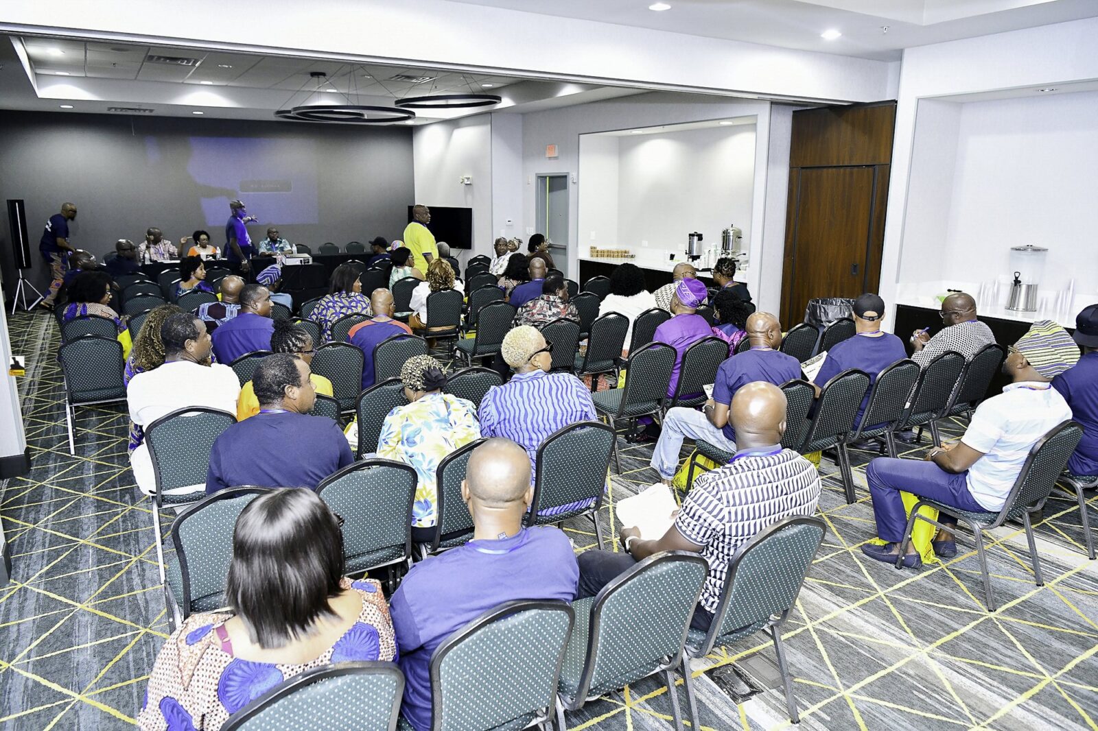 Rows of attendees in the convention room
