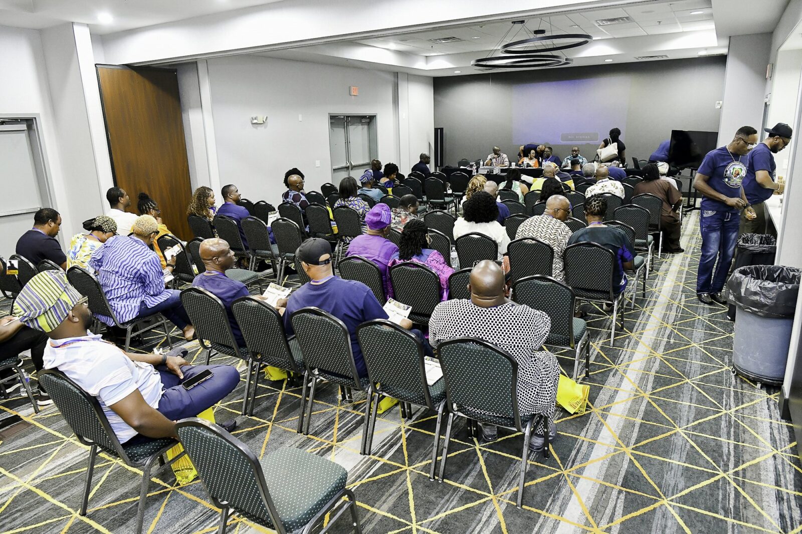 Rows of attendees in the convention room
