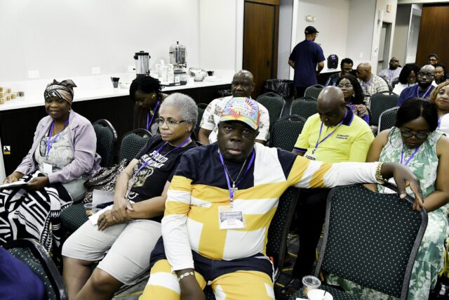 Attendees seated in rows at the convention