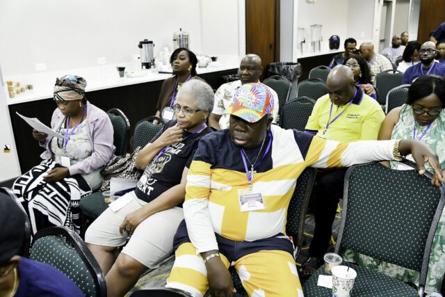Attendees seated in rows at the convention