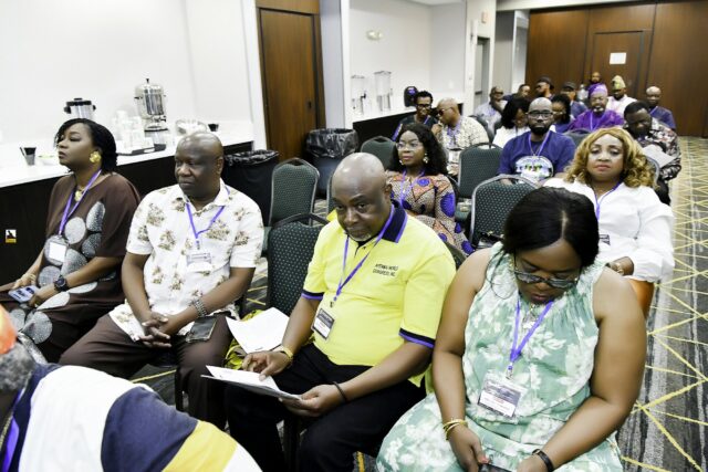 Attendees seated in rows at the convention