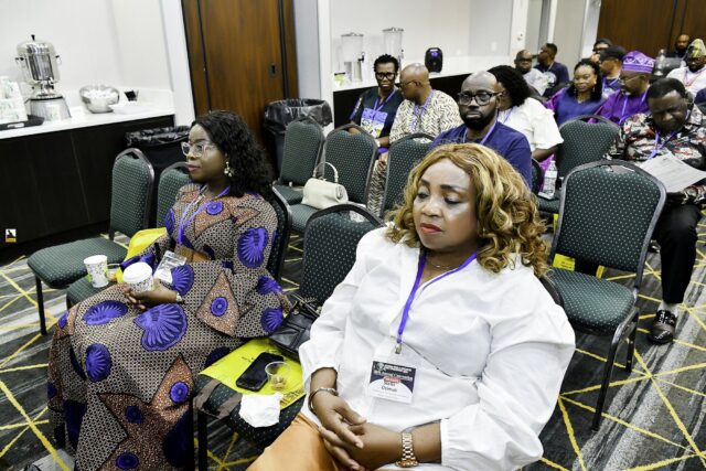 Attendees seated in rows at the convention