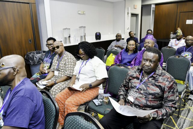 Attendees seated in rows at the convention