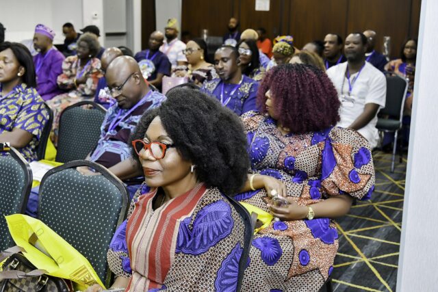 Women seated in a row at the gathering