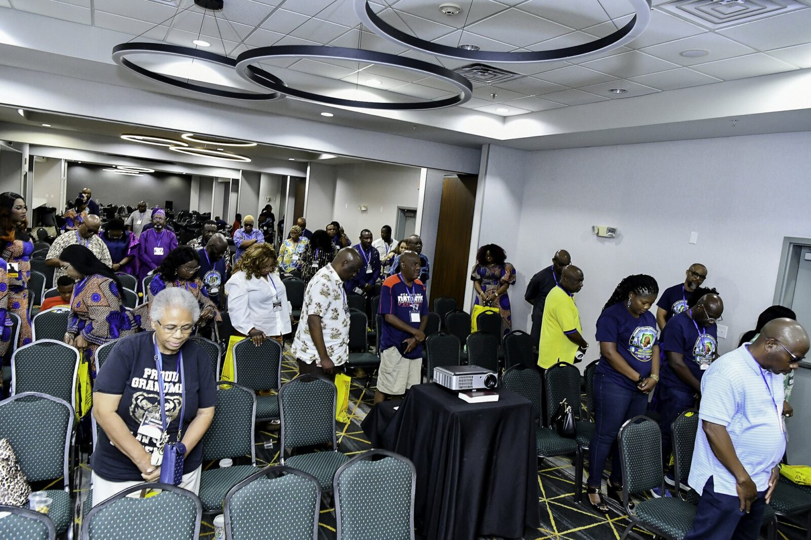 Attendees standing throughout the convention room