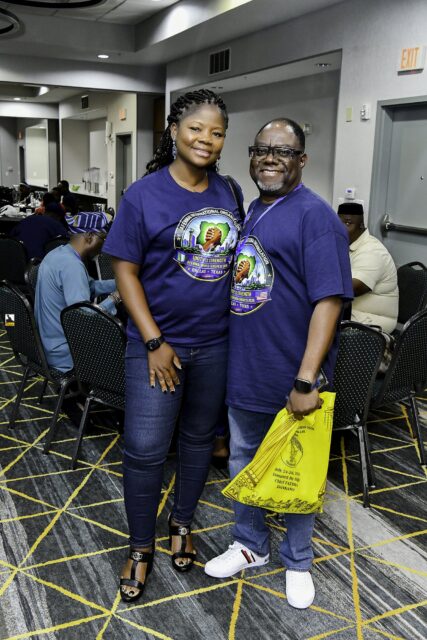 Two women in blue clothing standing together